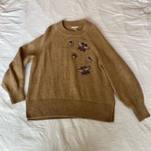Sweater with detailed patches